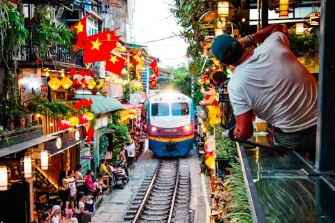 A train passing a crowd on Hanoi's train street
